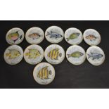 A Set of Eleven Kaiser West German Dishes decorated with fish,