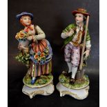 A Pair of Continental Porcelain Figure Groups 'The Gardeners' decorated in polychrome enamels and