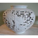 A Chinese Celadon Reticulated Globular Vase,