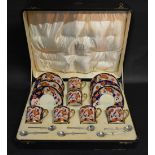 A Cased Noritake Coffee Service decorated in the Imari palette together with a set of six Sheffield