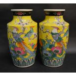 A Pair of Japanese Vases decorated in Polychrome Enamels with Exotic Birds amongst Foliage,