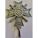 German WWII Knights Cross of the War Merit Cross neck medal with crossed swords. A fair copy