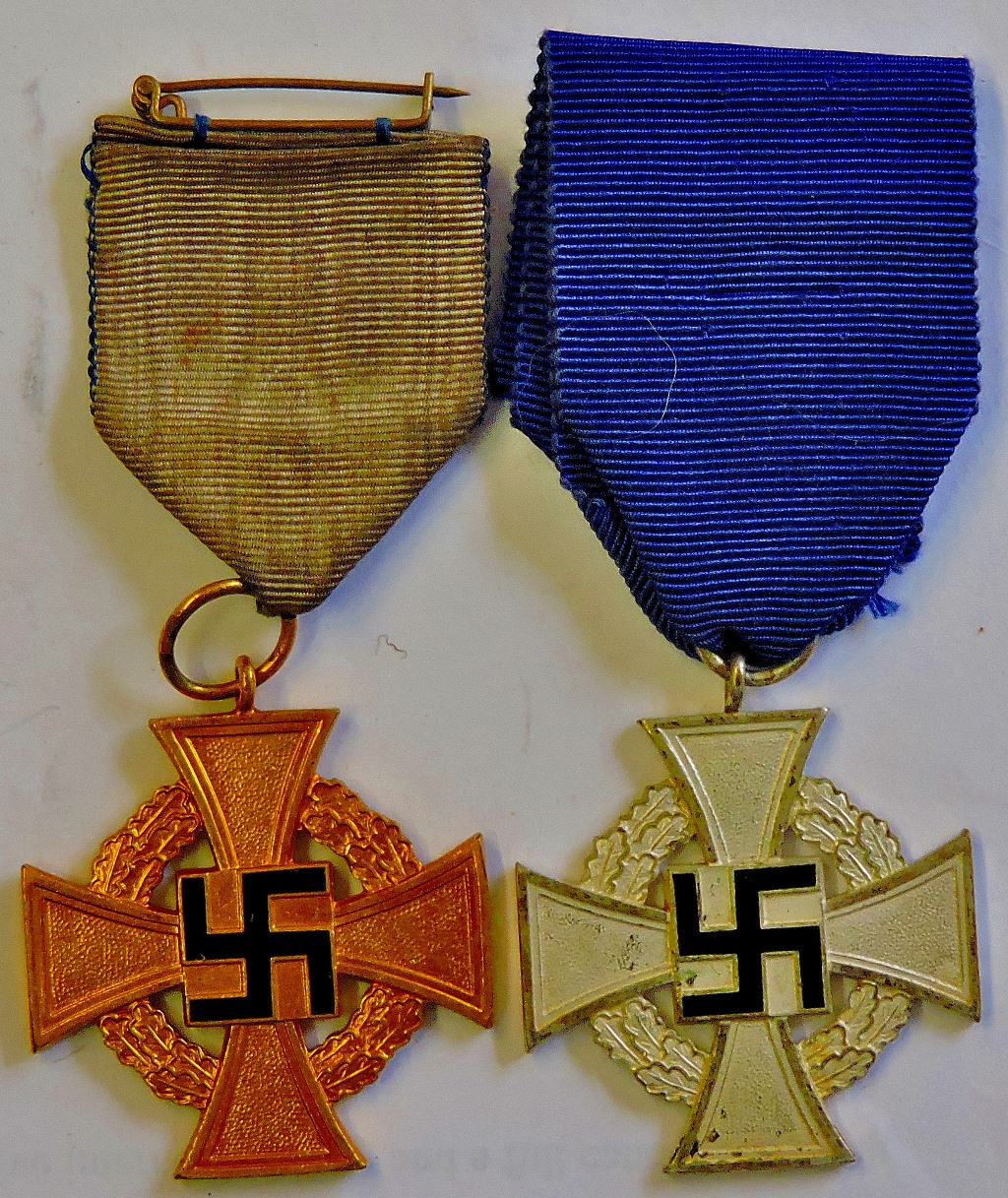 German WWII 25 Year and 40 Year Faithful Service Medals, Silver and Gold pattern.