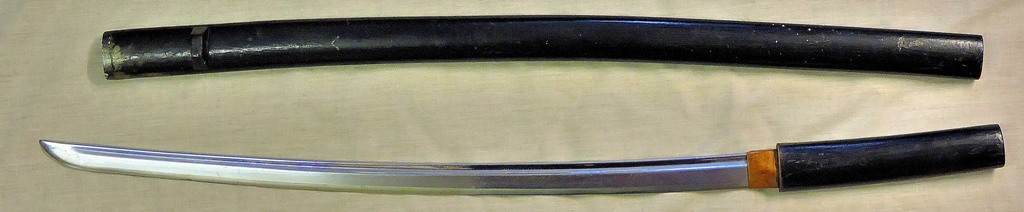 Japanese Katana sword, a contemporary made sword in black scabbard. Blade length 60.5cm's, overall