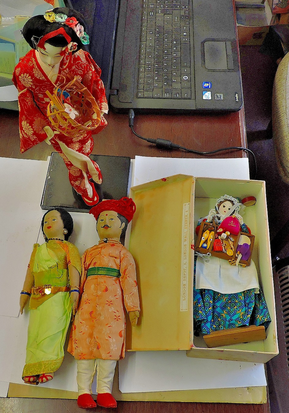 Vintage Dolls-with street vendor doll, Japan and India,(4 dolls) on plinth 1' x 1.1/2' high.