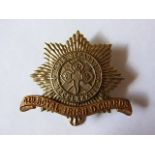 The 4th Royal Irish Dragoon Guards WWI Cap badge (Bi-Metal, slider) Maker J.R. Gaunt, K&K: 740