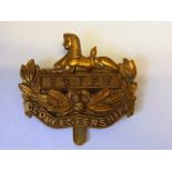 The Gloucestershire Regiment WWI Economy issue all brass cap badge (Brass, slider) Maker J. R.