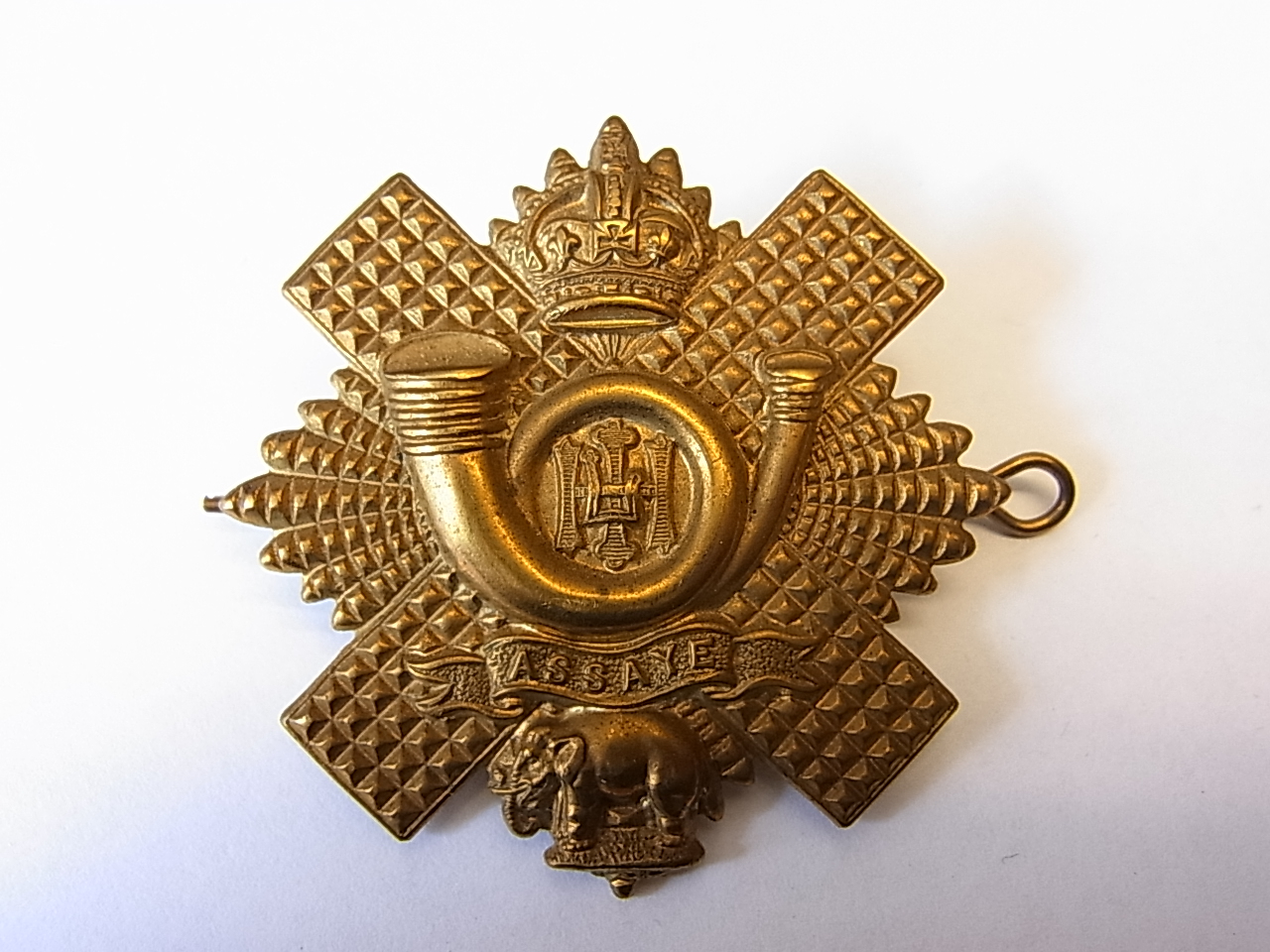 The Highland Light Infantry cap badge, KC (Brass, Lugs) NCO's variant, a scarce cap badge. K&K: 275