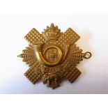 The Highland Light Infantry cap badge, KC (Brass, Lugs) NCO's variant, a scarce cap badge. K&K: 275