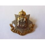 The East Surrey Regiment WWII Cap badge (Bi-metal, lugs) well polished.