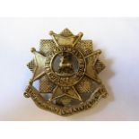 The Bedfordshire & Hertfordshire Regiment cap badge (White-metal, slider) Maker Maples & Beasley