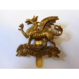 The Buffs' East Kent Regiment cap badge (Brass, slider) Maker J. R. Gaunt. London