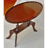 Coffee Table-A small, oval table measuring 29.1/2"long x 16" wide x 20"high, modern but in the