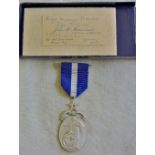 Freemasons Hospital medal, marked AEGROS SANAT HUMANITAS" (kindness heals the sick) flanking the