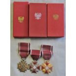 Polish Cross of Merit (PRL), 1st, 2nd and 3rd class all in original boxes of issue. A good