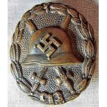 German WWII style early Spanish Campaign wound badge, original finish has gone with base metal