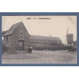 France - Moulin Mill, a good view of buildings with men standing in the foreground to the left and
