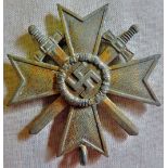 German WWII War Merit Cross 2nd Class with Crossed Swords. The original finish has mostly worn