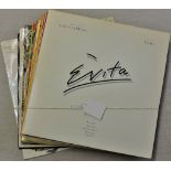 Vinyl records-Mix lot of (12) such aritist as Andrew Lloyd Webber's Evita,Boney M,Elvis, some are