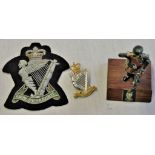Royal Irish Rangers related items including: A Royal Irish Rangers mounted figure, QC Blazer badge