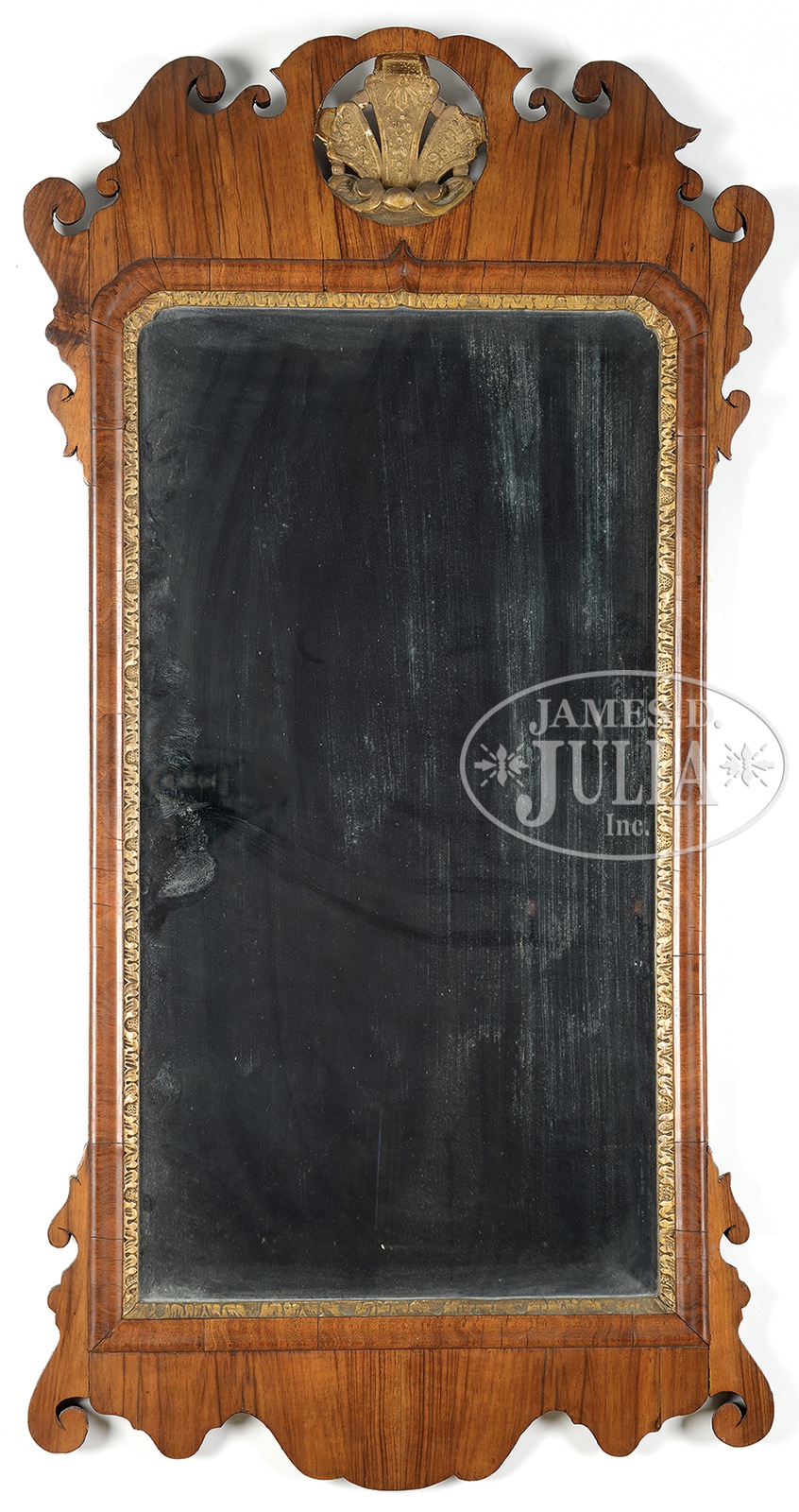 CHIPPENDALE WALNUT LOOKING GLASS. 3rd quarter 18th century. The rectangular beveled glass mirror