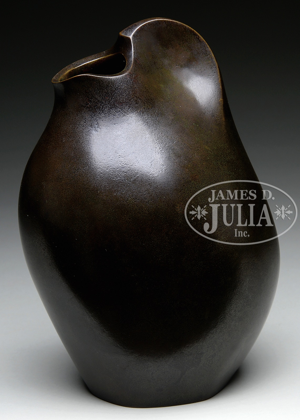 CONTEMPORARY BRONZE EWER. Bulbous form rising to a pinched handle connecting to the funnel