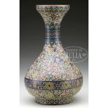 CLOISONNE BOTTLE VASE. Japan, 19th century. Made in the Chinese taste, the vase molded in bottle