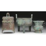 THREE ARCHAIC BRONZES. China, 20th century. 1) A tripod footed censer with tall loop handles. 2) A