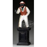 CAST IRON BLACK JOCKEY HITCHING POST. 24" figure holding a ring stands atop a 15" h square pedestal.