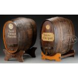 TWO LARGE VEUVE CLICQUOT WINE CASKS ON STANDS. One having bronze spigot marked "Harry Mason,