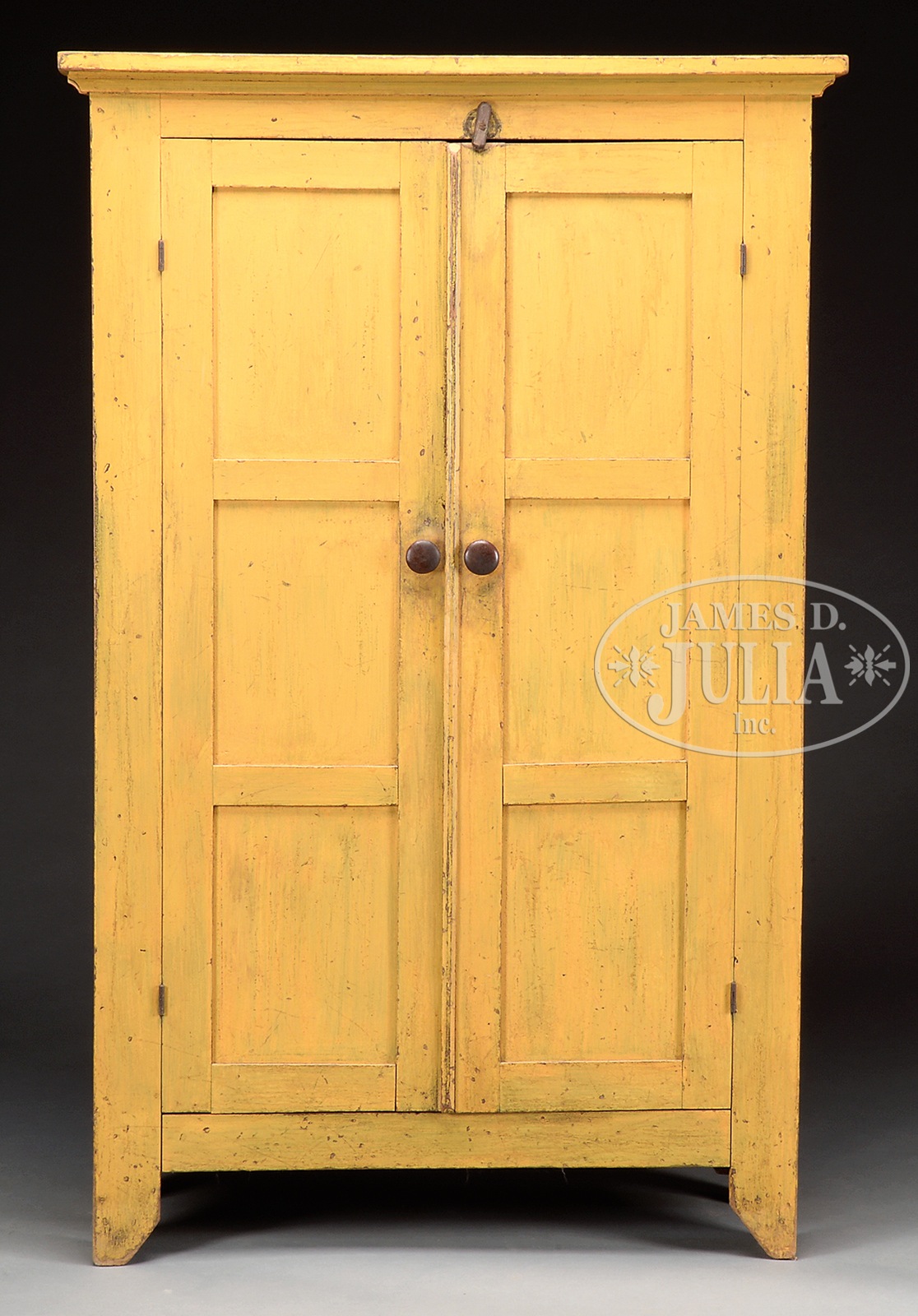 FINE BASSWOOD AND PINE PANTRY CUPBOARD IN YELLOW PAINT. 1st quarter 19th century, New York State