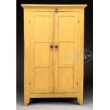 FINE BASSWOOD AND PINE PANTRY CUPBOARD IN YELLOW PAINT. 1st quarter 19th century, New York State