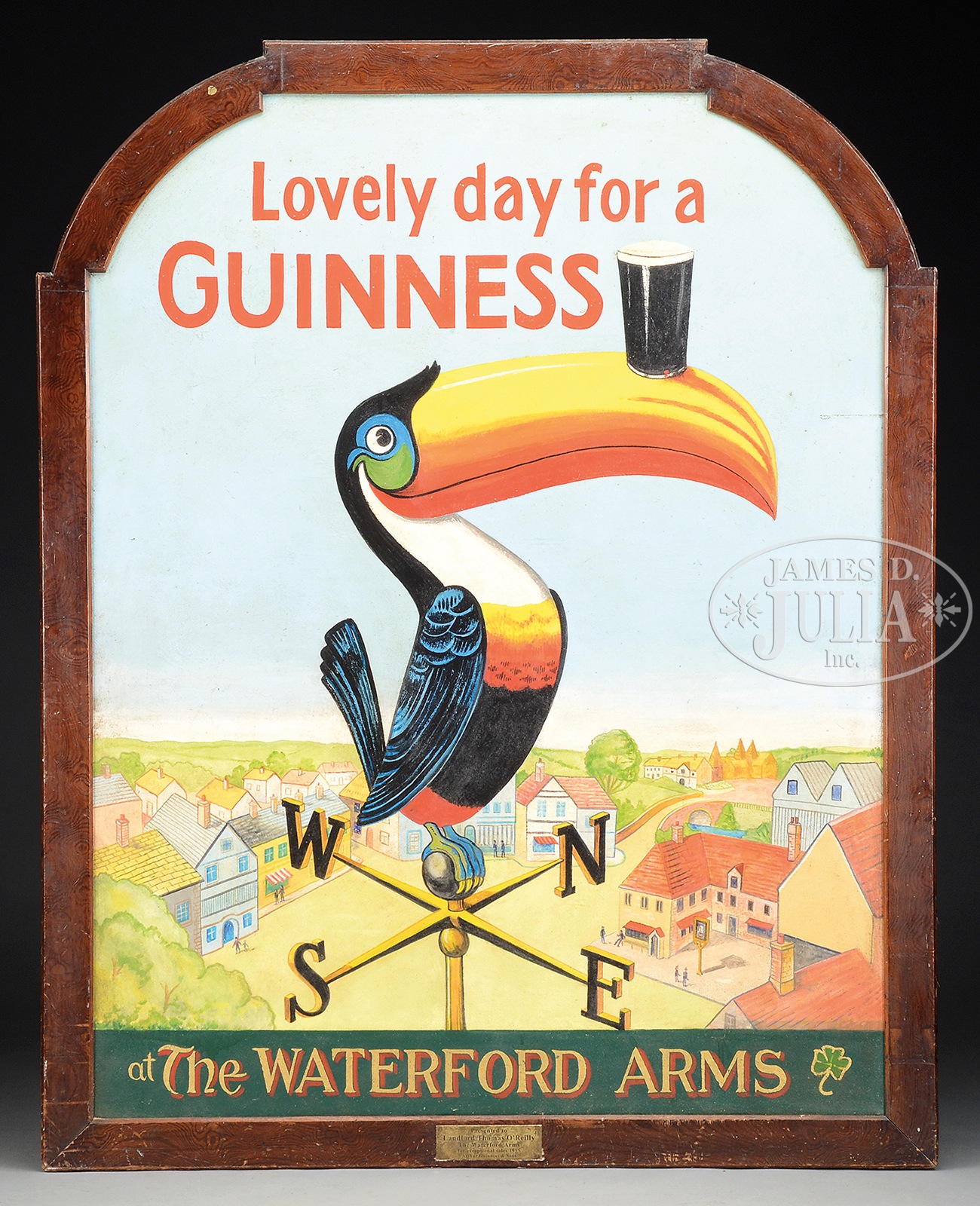 COLORFUL PAINTED WOOD GUINNESS SIGN AND LARGE AMBER GLASS GUINNESS BOTTLE. Large sign having over