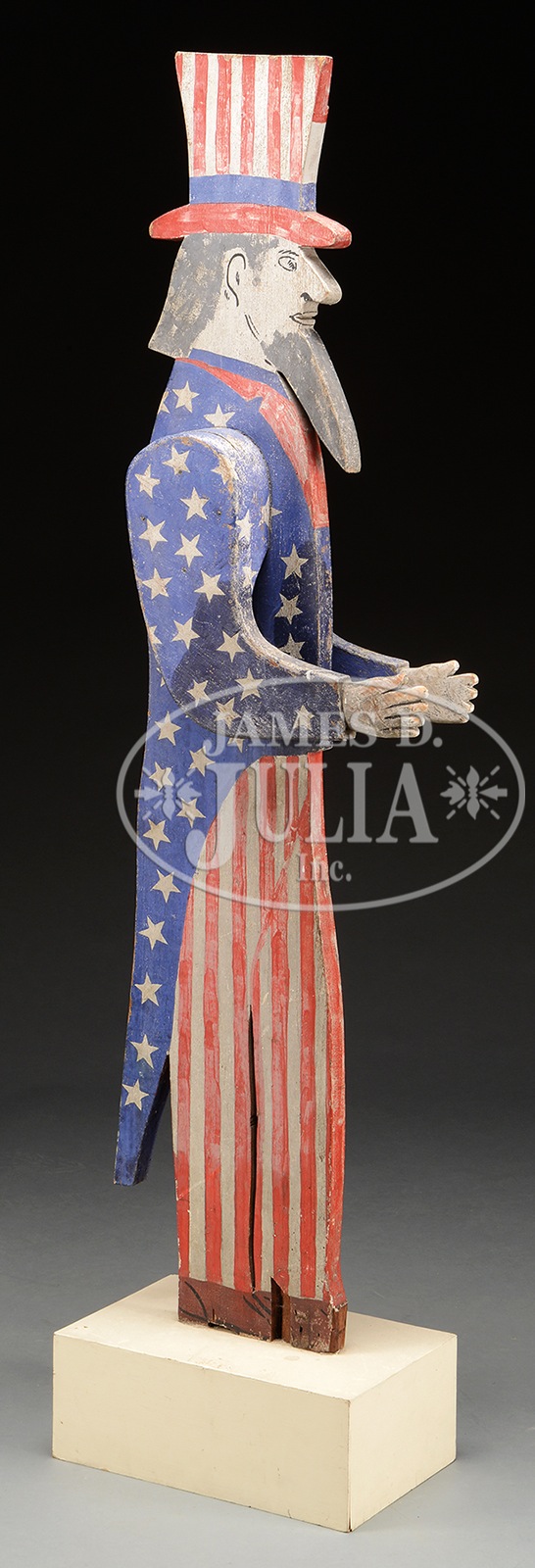 UNCLE SAM CARVED AND PAINTED MAILBOX HOLDER. The standing Uncle Sam in red, white and blue outfit