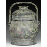 BRONZE COVERED WINE JAR. Probably 18th century, China. Archaic style Lei. Surfaces decorated with