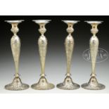 SET OF FOUR STERLING SILVER TALL CANDLESTICKS BY REED & BARTON.