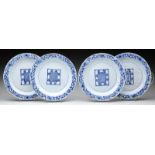 SET OF FOUR BLUE AND WHITE PLATES.