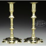 PAIR OF QUEEN ANNE BRASS PETAL BASE PUSH-UP CANDLESTICKS.