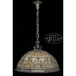 IMPRESSIVE TWELVE PANEL SILVERED HANGING DOME LAMP CAST WITH GROTESQUE MASKS AND SCROLLING FOLIAGE.