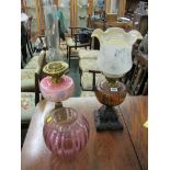 EDWARDIAN OIL LAMPS, attractive pink glass reservoir oil lamp with cranberry spherical shade and 1