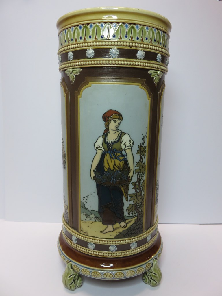 METTLACH, late 19th Century cylindrical vase decorated with 4 panels of peasant girls, mould no.