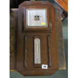 ANEROID BAROMETER, Art Deco oak surround wall mounted barometer