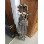 GOLF CLUBS, collection of hickery shaft early golf clubs and leather carrying bag