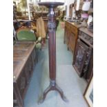 TORCHERE STAND, 19th century mahogany torchere stand, on fluted column support (Rim A/F),