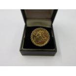 HALF SOVEREIGN RING, 1915 gold half sovereign in yellow metal ring mount,