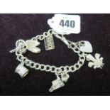 CHARM BRACELET, HM silver charm bracelet set 7 silver charms including spinning wheel,