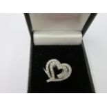 DIAMOND RING, diamond heart design ring in a white metal ring mount,