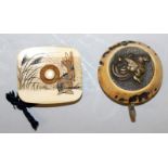 AN UNUSUAL JAPANESE RECTANGULAR IVORY MANJU NETSUKE, with rounded corners, its top surface