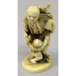 A JAPANESE MEIJI PERIOD IVORY OKIMONO OF A FISHERMAN, in the company of a boy and bearing a basket