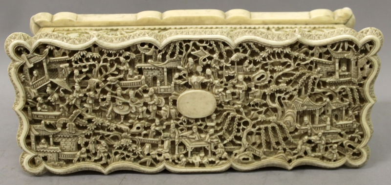 A GOOD 19TH CENTURY CHINESE CANTON IVORY CASKET, the shaped and hinged cover carved in deep relief - Image 5 of 9